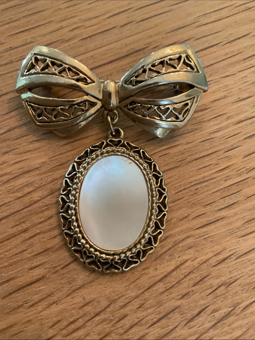 Vintage inspired Victorian Bow Brooch Filigree Dangling Oval Mother of Pearl